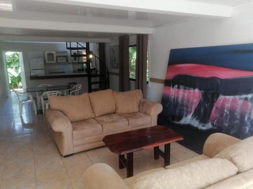 a living room with a couch and a table at El Castillo Monte Campana in Puntarenas