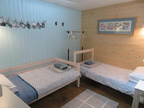 Säng eller sängar i ett rum på La Maison du Bonheur