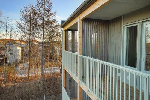 a balcony of a house with a view of the yard at Uppsala Hotel Apartments in Uppsala
