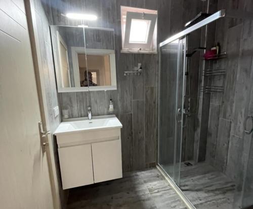 a bathroom with a sink and a shower at Stylish Ground floor 3-Bed Apartment in Dalyan in Ortaca