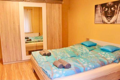 Postel nebo postele na pokoji v ubytování Relax Wellness Apartman