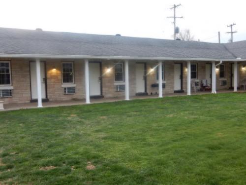 a house with a green lawn in front of it at Brown's Motel in Aberdeen
