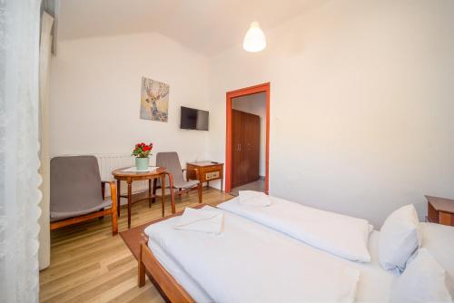 Cama o camas de una habitación en Lipicai Hotel és Étterem