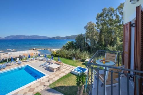 a swimming pool with a view of the water at Sami Beach Hotel in Sami