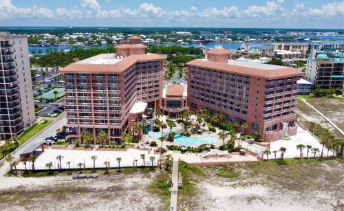 an aerial view of a resort with a pool and buildings at Perdido Beach Resort in Orange Beach