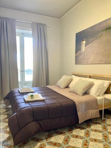 a bedroom with a bed with a tray on it at amurimè in Porto Empedocle
