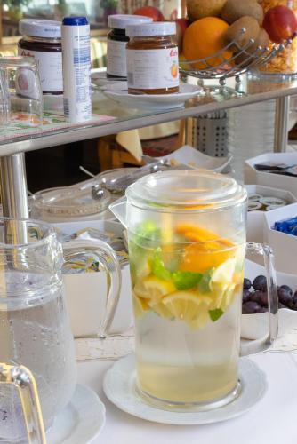 a cup of water with fruit in it on a counter at Gasthof Bären in Holzgau