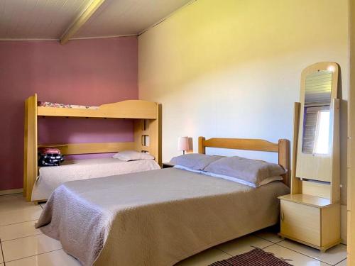 a bedroom with two beds and a bunk bed at sitio santa Eulalia in Cunha