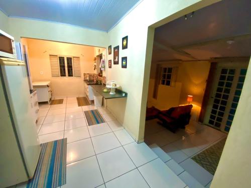 a view of a kitchen and a living room at sitio santa Eulalia in Cunha