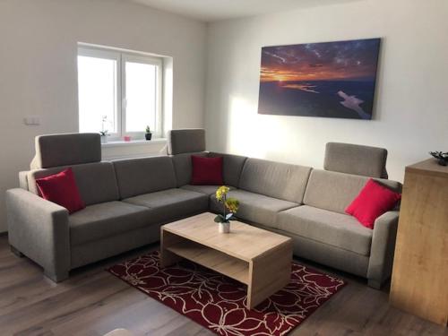 a living room with a couch and a coffee table at Papeto in Frymburk