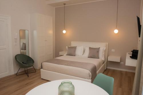 מיטה או מיטות בחדר ב-POSA - Charming Rooms