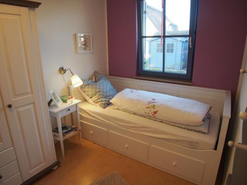 Llit o llits en una habitació de Emilias Hüs, Reethaus in der Bucht von Wismar