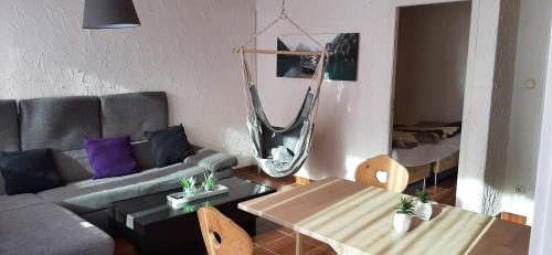 a living room with a couch and a table at Dachstein Adventure in Obertraun