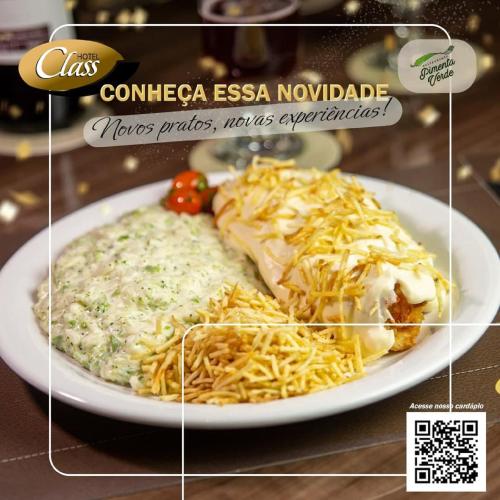 a plate of food with pasta and cheese on a table at Class Hotel Varginha in Varginha