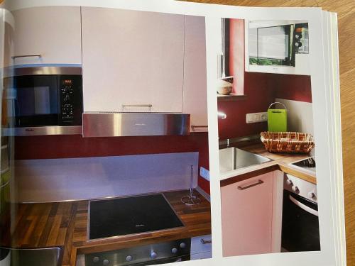 a kitchen with a microwave and a stove top oven at Schönwald Waldchalet am Musenberg in Stryck