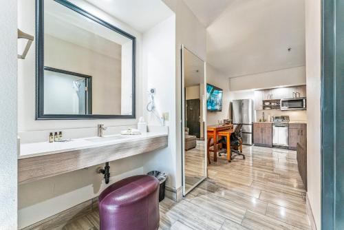 a bathroom with a sink and a mirror at Tempe Studio One bedroom 1st floor condos with construction discounts in Tempe
