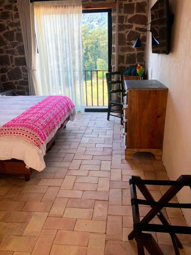 Una cama o camas en una habitación de Hotel Casa Xaa