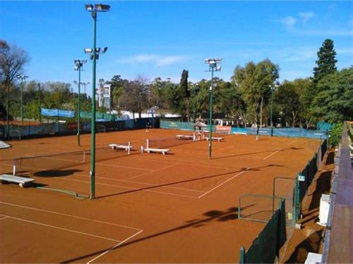 a tennis court with two people on it at Quinta Park in Mendoza