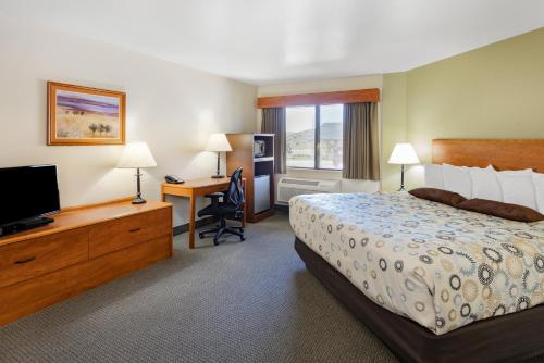 Ένα ή περισσότερα κρεβάτια σε δωμάτιο στο AmericInn by Wyndham Havre
