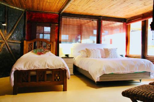 Giường trong phòng chung tại Loft de montaña El Quillay