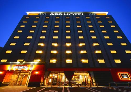 a black hotel building with lights on at APA Hotel Kagoshima Tenmonkan in Kagoshima