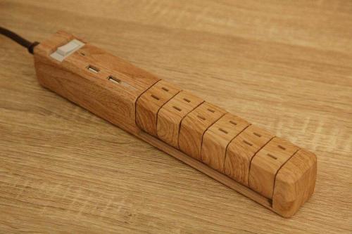 a wooden stick sitting on top of a wooden table at goom Hotel Fukuoka-Tenjin in Fukuoka