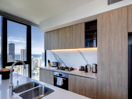 a kitchen with a sink and a counter top at The Star Residences - Gold Coast in Gold Coast