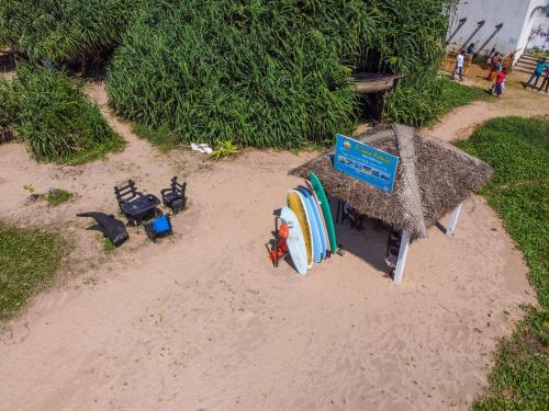 a model of a beach with a sign and surfboards at Chami Villa Bentota in Bentota