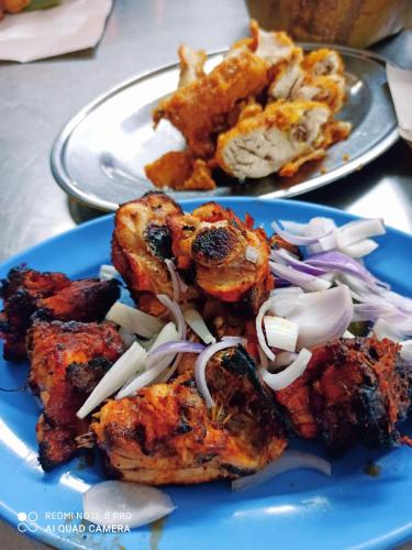 two plates of food on a blue plate at Bdr Bukit Tinggi Klang Tropicana Garden Homestay in Klang