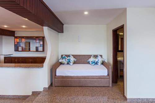 a bedroom with a bed with pillows on it at Douro House Loft in Tabuaço
