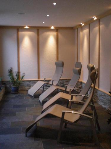 a row of chairs in a waiting room at Apart-Garni Motnaida in Samnaun