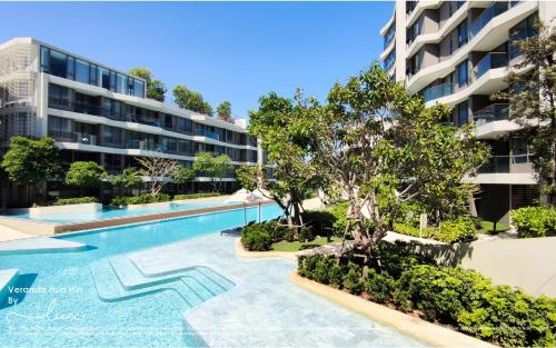 an image of a swimming pool in front of a building at VERANDA HUAHIN - Residence Pool Access in Hua Hin