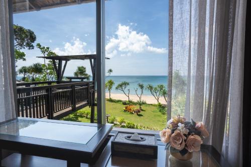 a room with a view of the ocean at Nirvana Beach Resort, Koh Lanta SHA Extra Plus in Ko Lanta