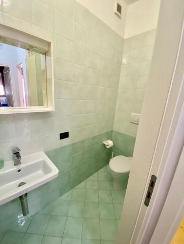 a bathroom with a toilet and a sink at CASA Di MIRKO in Gallipoli