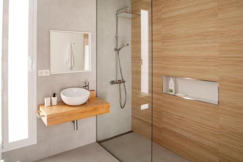 a bathroom with a sink and a shower at Areca by AGM Resorts in Puerto del Carmen