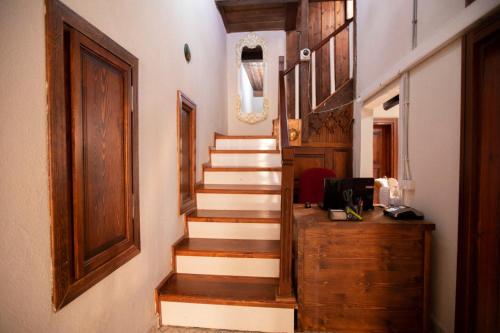 a hallway with stairs and a door and a desk at Lily Town Hotel in Antalya