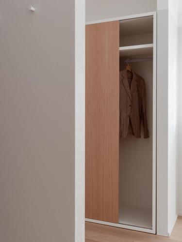 a wardrobe in a room with a jacket in it at Agriturismo Terra del Sole in Albosaggia