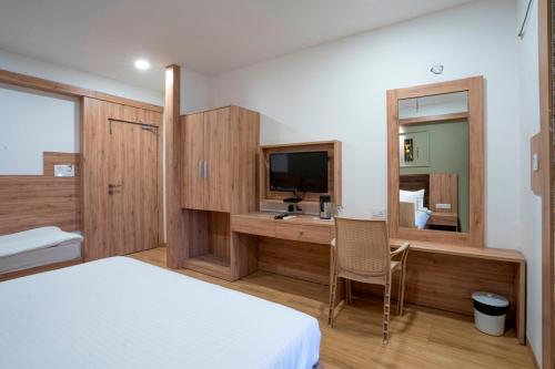 A bed or beds in a room at Hotel BRG BUDGET STAY