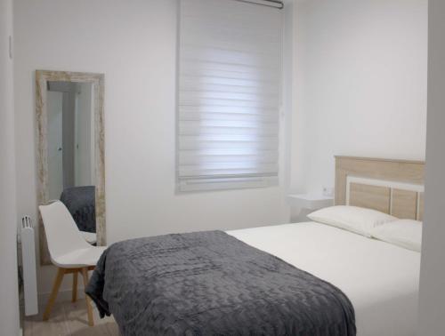 En eller flere senge i et værelse på Piso recién reformado Galiano