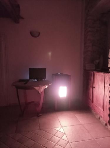 a room with a table with a computer on it at Piccola Azzurra in Comiso