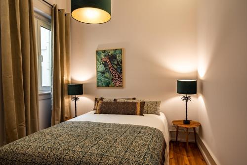 מיטה או מיטות בחדר ב-Akicity Sete Rios Iris
