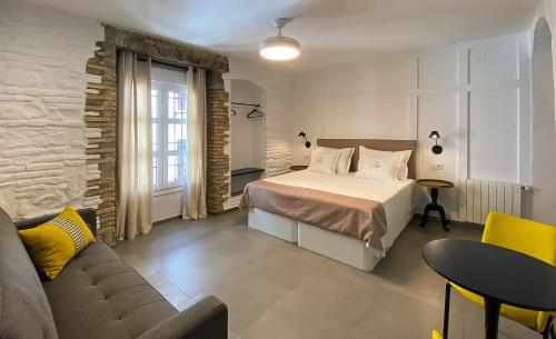 Postel nebo postele na pokoji v ubytování EL ZAGUÁN DE LA JUDERÍA