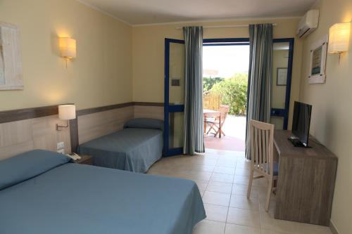 Ένα ή περισσότερα κρεβάτια σε δωμάτιο στο Hotel Villa Giulia