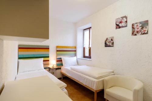 Cama o camas de una habitación en Residence Rustico