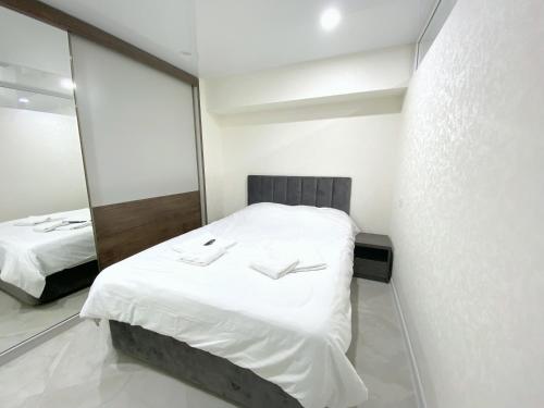 Postel nebo postele na pokoji v ubytování GSS Apartment