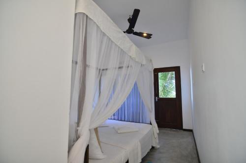 Postel nebo postele na pokoji v ubytování SUNSET Cabana