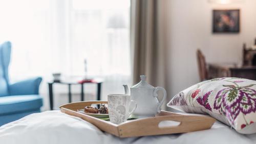En eller flere senge i et værelse på Store Ringheim Hotel og Restaurant