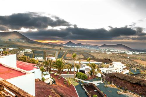 a view of a city with mountains in the background at Casona de Tao in Tiagua