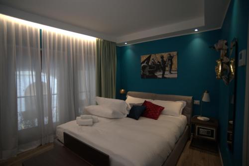 Letto o letti in una camera di Dimora del Teatro