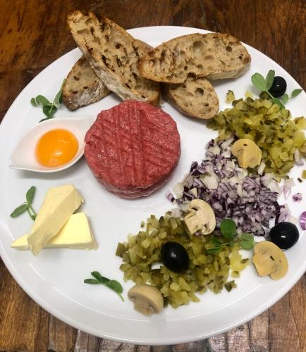 a plate of food with different types of food at Sosnowe Zacisze in Białystok